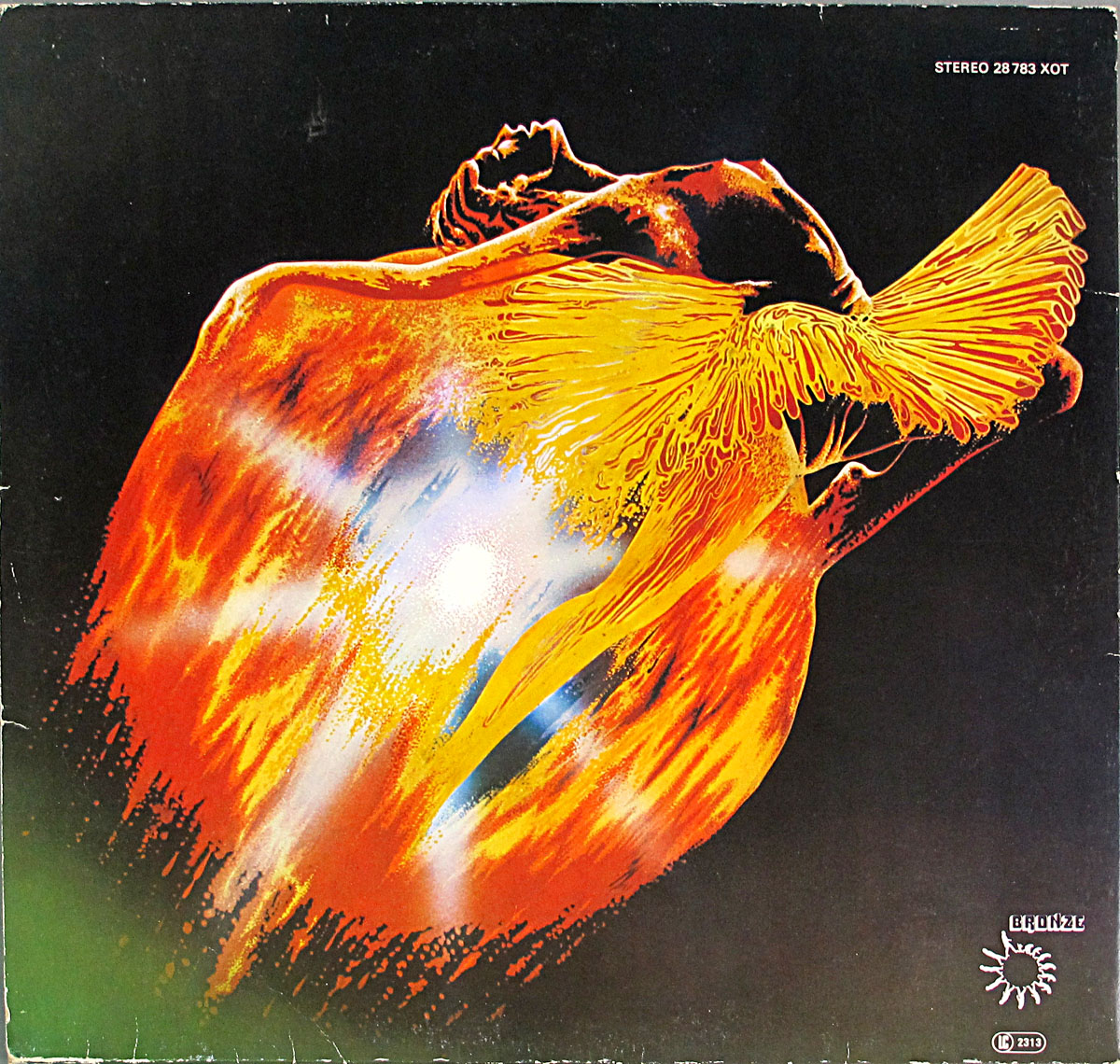 Back cover of Uriah Heep's Return to Fantasy album (1975), featuring the golden-winged figure and fiery explosion from the front, with album details like catalog number STEREO 28 783 XOT and the Bronze Records logo.